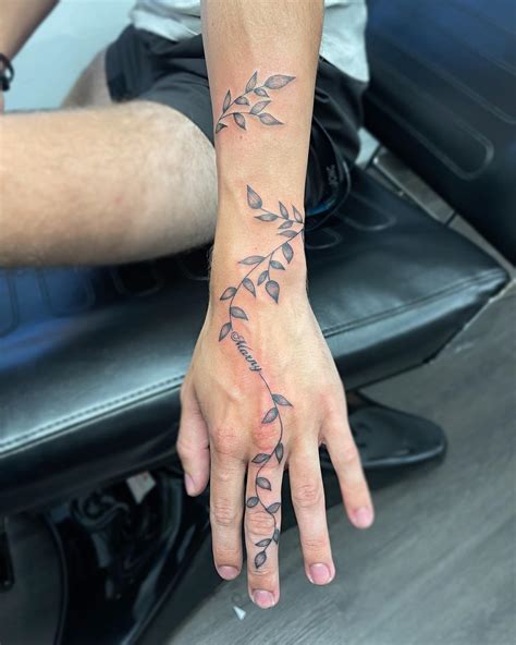 vine hand tattoos